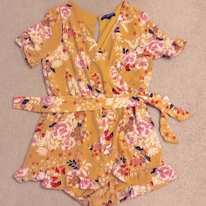 One clothing yellow/gold one piece romper.